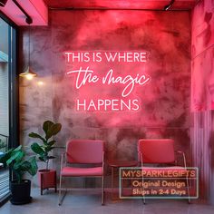 this is where the magic happens neon sign in front of a wall with two chairs