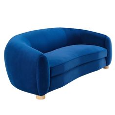 a blue couch sitting on top of a white floor