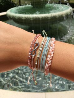 "TIFF&E waterproof bracelets and anklets are perfect for your active lifestyle - wear them anywhere... beach, pool, gym, shower, you name it! Alone or stacked with others, they give an effortless bohemian vibe and wearing them everyday will only enhance the natural look and feel. Each TIFF&E item is: -handmade with meticulous attention to detail using high quality waterproof waxed polyester string -adjustable using our unique minimalist sliding knot -super cute and fun when stacked with Casual Pink Beaded Bracelets For Festivals, Casual Resizable Beaded Bracelets For Beach, Casual Braided Strand Bracelets As Gift, Casual Resizable Braided Bracelets For Beach, Casual Braided Strand Bracelet As Gift, Adjustable Braided Bracelets For Beach Season, Adjustable Pink Braided Bracelets For Beach, Hypoallergenic Beaded Bracelets For Beach, Adjustable Pink Braided Bracelet For Beach