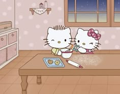 two hello kitty characters are making cookies on a table in a room with polka dot walls