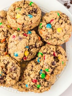 a white bowl filled with cookies and m & m's