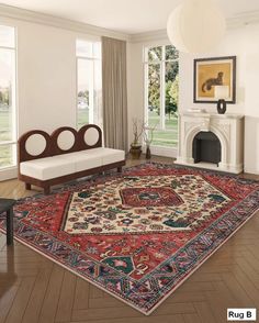 a living room filled with furniture and a rug on top of a hard wood floor