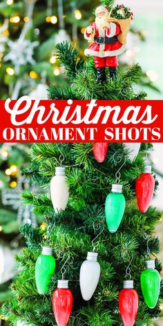 Bright colored red, white and green alcohol shots on a Christmas tree. Christmas Themed Shots Party Ideas, Christmas Shooter Ideas, Ornament Shot Recipe, Christmas Tree Shots, Drinks In Ornaments, Christmas Ornament Shots, Adult Christmas Party Food, Christmas Shots For Adults, Christmas Shot Ideas