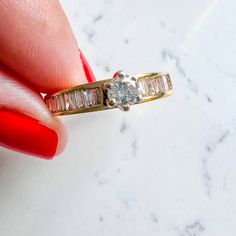 Princess cut & Baguettes Vintage Engagement Ring 14K Yellow Gold Center stone Round Diamond 0.25Ct I Color IS1 Baguette Diamond side stones 0.30Ct J/I Color SI1/SI2 3.4gm Size 7.25 Sizing available with fee contact us to have it added to the price before check out. Thank you for visiting our shop! Visit our website DmKJewelry.com Also Follow us on Instagram https://www.instagram.com/dmkjewelry_/ Moissanite Diamond Ring With Baguette Diamonds For Promise, Channel Set Baguette Rings For Anniversary, Baguette Channel Set Rings For Anniversary, Diamond White Cluster Ring With Baguette Diamonds For Promise, Emerald Cut Baguette Diamond Promise Ring, Promise Ring With Baguette Diamonds, Dazzling Round Cut Diamond Ring With Baguette Diamonds, Dazzling Round Cut Baguette Diamond Ring, Baguette Cut Diamond Promise Ring With Prong Setting