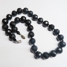 On offer is this Antique Victorian Black Mourning Whitby Jet Graduated Necklace that has been expertly hand carved into huge half inch diameter Whitby gems that gleam and catch the light. Whitby Jet was brought to the attention of the world by Queen Victoria who used Whitby Jet as part of her mourning attire. Today, genuine Antique Whitby Jet is highly collectable and sought after world wide. This necklace features beautifully faceted gems with a very high reflective polish of the blackest of bl Formal Onyx Round Bead Necklaces, Formal Onyx Necklace With Round Beads, Formal Onyx Jewelry With Polished Beads, Formal Onyx Necklace, Formal Onyx Beaded Necklace With Round Beads, Formal Onyx Beaded Necklace, Black Faceted Round Necklace, Polished Onyx Bead Necklace, Luxury Faceted Beaded Necklace For Formal Occasions