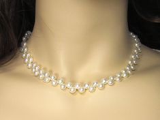 6 & 7 mm white half round genuine pearl necklace JNHRBA665 & JNHRBA775 PRODUCT INFORMATION: * Pearl Type: Genuine freshwater pearls with natural luster. * Pearl Color: White. * Clasp: Rhodium plated. * Pearl Shape and Size: Half Round freshwater pearls 6-6.5 & 7-7.5mm(approx.). * Pearl Luster: Good Luster. * Length: 16".  * Material: Genuine freshwater pearl. PROCESSING TIME & SHIPPING * Processing time: 1 to 3 business days. * Shipping cost is only applied for first item of the order. Shipping Elegant Round Beads Pearl Necklace With Adjustable Fit, Elegant Adjustable Pearl Necklace With Round Beads, Elegant Pearl White Jewelry With 8mm Beads, Formal Adjustable Pearl Necklace With Pendant, Elegant Pearl Jewelry With 8mm Beads, Pearl Necklace With Round Beads For Jewelry Making, Classic Pearl Choker Necklace As Gift, Classic Pearl Choker Necklace For Gifts, Classic Handmade Pearl Jewelry