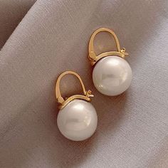 White Clip-on Pearl Earrings For Evening, Elegant Pearl White Clip-on Pearl Earrings, Formal White Pearl Drop Clip-on Earrings, Elegant Pearl White Clip-on Earrings, White Pearl Drop Clip-on Earrings, Elegant White Clip-on Earrings With Pearl Charm, White Pearl Clip-on Earrings, White Dangle Clip-on Pearl Earrings, White Dangle Pearl Clip-on Earrings