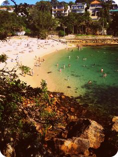 the beach is crowded with people on it