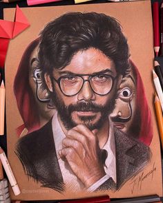 a pencil drawing of a man with glasses and a beard next to colored crayons