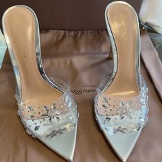 Gianvito Rossi Silver Halley 105 Heeled Mules! Never Worn, Brand New, With Box, And Dust Bag. Excellent Condition. Never Worn. Size 35.5 - Open Pointed Toe - Heel: H4in - Leather Sole -Transparent Vinyl Embellished Wedding Shoes For Party, Luxury Crystal Embellished Heels For Spring, Clear Embellished Party Heels, Cocktail Wedding Shoes With Wrapped Heel, Luxury Rhinestone Heels For Spring, Luxury Open Heel Wedding Shoes For Party, Luxury Wedding Shoes With Padded Heel For Party, Chic Crystal-embellished Heels, Chic Crystal Embellished Heels