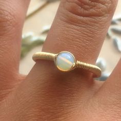 22.00 GBP This beautifully simple wire wrapped ring is lovingly handmade with a Opalite Moonstone and a choice of 14k Gold Filled, 14k Rose Gold Filled or Sterling Silver ​band. M A T E R I A L S: • Opalite Moonstone • 14k Gold Filled, 14k Rose Gold Filled or Sterling Silver S I Z E: • Gemstone - Approximately 4mm All of our jewellery is carefully handmade using good quality materials and handpicked gemstones, with the aim to produce quality pieces that you can love & wear for years to… Opalite Ring, Simple Wire Wrap, Peruvian Jewelry, Pink Gemstone Necklace, Aluminum Jewelry, Inner Growth, White Jewelry Box, Pink Tourmaline Ring, Wire Wrapped Ring