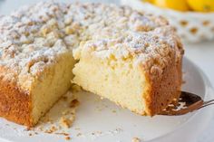 a close up of a cake on a plate with a slice taken out of it