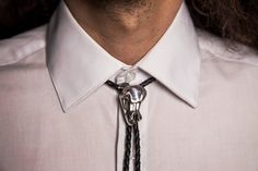 Genuine black leather braided tie with sliding adjustable bolo. Available in Sterling silver, white bronze, bronze and copper with matching bolo tips. Elegant Adjustable Concho Bolo Ties, Formal Adjustable Concho Bolo Ties, Elegant Concho Bolo Tie, Adjustable Formal Bolo Tie With Concho, Black Adjustable Bolo Tie For Formal Occasions, Adjustable Western Bolo Tie For Formal Occasions, Adjustable Elegant Bolo Ties For Formal Occasions, Elegant Adjustable Bolo Ties For Formal Occasions, Silver Lariat Bolo Tie For Formal Occasions