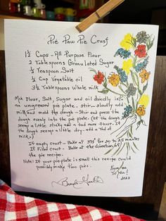 a handwritten poem is displayed on a piece of paper that has been pinned to a wooden easel