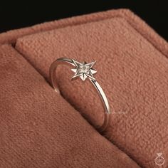 Moissanite North Star Ring 14k Gold Dainty Celestial Star Ring North Star Cluster Ring Pole Star engagement ring Star Wedding Ring for Women ✥ 𝐖𝐞𝐥𝐜𝐨𝐦𝐞 𝐭𝐨 𝐀𝐝𝐨𝐫𝐧𝐉𝐞𝐰𝐞𝐥𝐥𝐞𝐫𝐲𝐈𝐍: 𝐔𝐧𝐯𝐞𝐢𝐥 𝐭𝐡𝐞 𝐁𝐞𝐚𝐮𝐭𝐲 𝐨𝐟 𝐆𝐨𝐥𝐝 & 𝐌𝐨𝐢𝐬𝐬𝐚𝐧𝐢𝐭𝐞 𝐃𝐢𝐚𝐦𝐨𝐧𝐝 𝐉𝐞𝐰𝐞𝐥𝐫𝐲! ✥ ↣ 𝐌𝐚𝐭𝐞𝐫𝐢𝐚𝐥𝐬: 925 Sterling Silver, Gold, Rose Gold, White Gold ✥ 𝐌𝐨𝐢𝐬𝐬𝐚𝐧𝐢𝐭𝐞 𝐃𝐢𝐚𝐦𝐨𝐧𝐝 𝐒𝐩𝐞𝐜𝐢𝐟𝐢𝐜𝐚𝐭𝐢𝐨𝐧𝐬: ↣ 𝐒𝐡𝐚𝐩𝐞: Round Cut ↣ 𝐃𝐢𝐦𝐞𝐧𝐬𝐢𝐨𝐧: 2.00 MM ↣ 𝐂𝐚? Star Engagement Ring Silver, Star Shaped Ring, Engagement Rings Star, Star Ring Engagement, Star Wedding Ring, Celestial Engagement Ring, Star Engagement Ring, North Star Ring, Stars Ring