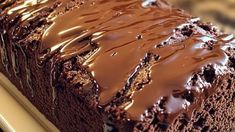 a close up of a cake with chocolate frosting