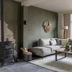 a living room filled with furniture and a fire place