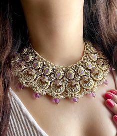 Adorn yourself in timeless elegance with this exquisite lilac purple necklace set, perfect for weddings and special occasions. Crafted with meticulous attention to detail, the set features soft lilac hues reminiscent of Pakistani and Punjabi traditions, with a touch of Bollywood glamour. Complete with matching earrings and a stunning maangtika, this Indian Kundan ensemble effortlessly captures the essence of sophistication and grace. Measurements:  Necklace Weight-150 gms  Necklace width- 11 inc Bollywood Glamour, Purple Necklace, Kundan Necklaces, Indian Wedding Jewelry, Pakistani Wedding, Wedding Jewelry Sets, Flower Jewellery, Matching Earrings, Necklace Set