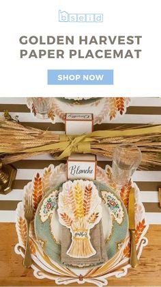 the golden harvest paper placemat is on display in front of a striped wall and wooden table