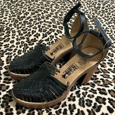 A Handmade Pair Of 100% Leather High Heel Wedges Featuring A Mexican Huarache Design! Size 8 But Can Fit A 8 1/2. Made With Premium Rubber Soles. Inner Sole Is Lined With Authentic Leather. 2 1/2 Block Heel For A Stylish Look! New And Never Worn, The Leather Will Mold To Your Feet. Fits A Size 8 Or 8 1/2 Shoe Size 2 1/2 Block Heel Perfect For A Huarache Fan! ***Check Out My Closet For Other Shoes And Clothing Items*** Black Closed Toe Wedge Sandals Medium Width, Black Low Heel Clogs With Removable Insole, Black Sandals With Wooden Low Heel, Black Leather Wedge Sandals With Reinforced Heel, Black Platform Sandals With Low Heel, Black Low Heel Wedge Sandals With Removable Insole, Black Clogs With Heel Strap And Round Toe, Black Leather Closed Toe Wedge Sandals, Black Low Heel Wedge Sandals With Stacked Heel