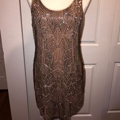 Urban Outfitters Ecote Beaded Mini Dress. Fitted Silhouette Cut Short With Beautiful Beaded Embellishments. There Are 2 Spots Where There's Pulling/Loss Of Beads, But Not Noticeable At All. A Pretty Mauve/Pinkish Color With Silver, Gray And Copper Colored Beads. Perfect For New Years, Fancy Wedding/Party,Etc. Form Is A Size 6 And It Fits Perfectly. Never Worn, Nwt. Extra Beads, Etc Still Attached! Champagne Sleeveless Sequin Dress, Glamorous Beaded Sleeveless Sequin Dress, Sleeveless Beaded Sequin Dress For Cocktail, Sleeveless Beaded Sequin Cocktail Dress, Holiday Champagne Embellished Sequin Dress, Glamorous Beaded Sleeveless Mini Dress, Urban Outfitters Sleeveless Mini Dress For Party, Champagne Embellished Sequin Dress For Night Out, Sleeveless Embellished Sequin Dress For Party