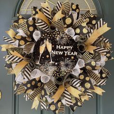 a happy new year's wreath on the front door