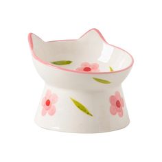 a white bowl with pink flowers painted on it