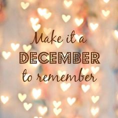 the words make it a december to remember on a blurry background with heart - shaped lights