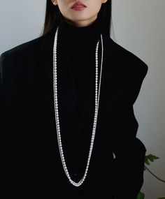 Introducing our long sweater necklace featuring multiple layers of natural freshwater pearls, the multi-layered design adds elegance and allows you to easily enhance your style.This piece has a delicate figure-eight buckle and is embellished with tiny sparkling diamonds for a subtle touch of sophistication. The buckle is designed to be easily removed, allowing you to wear it in a single layer for a more discreet look.The extra long length of this necklace offers endless styling possibilities, al Sweater Necklace, Long Silver Necklace, Long Necklaces, Sparkling Diamond, Layered Design, Freshwater Pearl Necklace, Long Sweater, Freshwater Pearl Necklaces, Recycled Sterling Silver