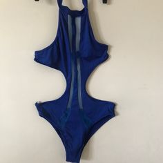 Nwot Blue Cut Out Halter Swimsuit. Small. Sheer Panel Inserts From Neckline To Bottom Of Swimsuit. Halter Tie Cut Out Back. Very Cute And Sexy For That Daring Fun Occasion. Blue Fitted Backless One Piece, Blue Fitted Backless One-piece, Blue Backless One Piece With Lined Body, Blue One-piece Lined Bodysuit, Royal Blue Swimwear For Summer Party, Blue Lined One-piece Bodysuit, Blue Summer One-piece With Lined Body, Blue Stretch Backless Bodysuit, Blue Halter Neck Bodysuit For Summer