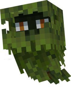 an image of a green monster made out of pixellated blocks with eyes and nose