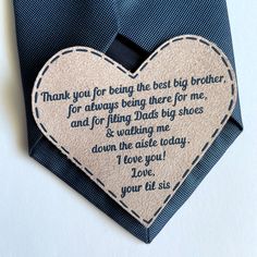 a blue tie with a heart - shaped tag attached to it that says, thank you for being the best brother for always being there for me