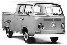 an old vw bus is shown in this black and white photo