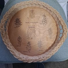 a wooden bowl sitting on top of a blue cushion