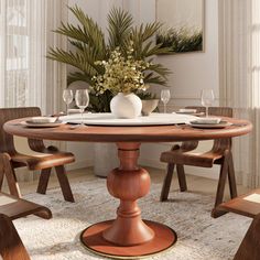 a dining room table with chairs around it and a vase filled with flowers on top