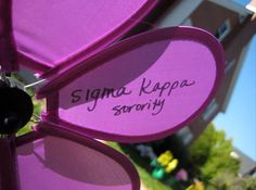 there is a purple umbrella with the name sagana kappa sorry written on it