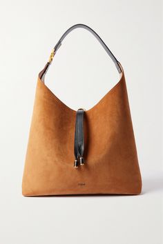 Chloé's bag is the latest addition to the house's iconic 'Marcie' collection. Crafted from suede, it has a sleek shape and enough space inside for your essentials - think wallet, keys and water bottle. The supple leather shoulder strap offers a pop of contrast while complementing the gold-tone hardware so nicely. Slouchy Tote, Slouchy Bag, Boho Trends, Trending Handbag, Chloe Marcie, Bag Trends, Chloe Bag, Boho Bag, Hailey Bieber