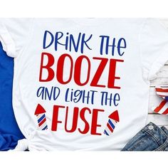 a t - shirt that says drink the booze and light the fuse on it