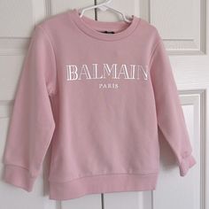 Purchased From Harrods In London. Nwt. The Perfect Light Pink With Metallic Silver Balmain Paris Logo Long Sleeve Sweater With Logo Print For Spring, Spring Long Sleeve Sweater With Logo Print, Fitted Letter Print Sweatshirt For Spring, Pink Long Sleeve Top With Logo Print, Pink Logo Print Top For Winter, Pink Tops With Logo Print For Winter, Winter Pink Tops With Logo Print, Balmain Shirt, Balmain Sweater