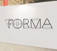 a white wall with the word forma written on it