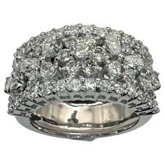 Exquisite Multi-stone Diamond Ring, Pear-shaped Multi-stone Diamond Anniversary Ring, Exquisite Pear-shaped Anniversary Rings, Luxury Flower-shaped Diamond Anniversary Ring, Anniversary Multi-stone Dome Ring In Fine Jewelry Style, Wide Band Ring, Wide Band Rings, Pear Shaped Diamond, Wide Bands