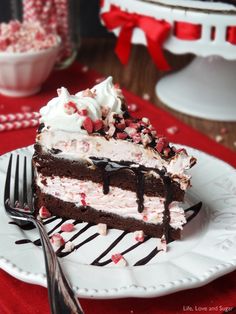 a slice of peppermint brownie ice cream cake on a plate with a fork