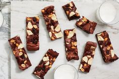 chocolate brownies with nuts and milk on a marble table