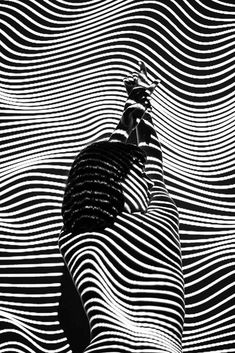 an abstract black and white photo with wavy lines