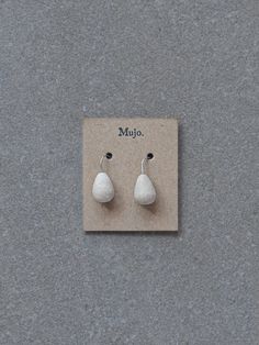 These earrings are lightweight and very versatile, perfect to wear casually or when you're wanting to feel a little more special. Each pair is individually handcrafted and hand finished, with a focus upon slow traditional processes - making hand-built stoneware ceramics and then hand forming silver wires through bending and hammering stages. Details: Colour: Natural unglazed stoneware clay Handcrafted from 100% stirling silver wires, and hand formed and fired drop shaped stoneware pottery beads. Handmade Teardrop Wrap Earrings In Minimalist Style, Handmade Minimalist Teardrop Wrap Earrings, Minimalist Jewelry In Natural Tones As A Gift, Artisan Teardrop Single Earring, Artisan Single Teardrop Earring, White Artisan Earrings For Pierced Ears, Handmade Minimalist Teardrop Earrings, Handmade Minimalist Dangle Wrap Earrings, Handmade Drop Wrap Earrings For Everyday