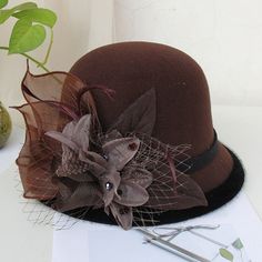 Gurl, dress your look to the nines with the perfect headwear. Our wide variety of hats guarantee you'll look your best for any event. Our fedora style hat is a chic accessory, adorned with a flower for an elegant touch. Daddies and Drags alike will love our selection, all crafted from wool and cotton for the utmost comfort. Make Hat Queen Orchya's Fedoras your crowning glory! Material: Wool, Cotton Item Type: Fedoras Head Circumference: 22"- 22.8" / 56cm - 58cm Womens Fedora, Hip Pads, Fedora Hat Women, Queen Love, Kentucky Derby Hat, Color Cafe, Drag Queens, Cloche Hat, Casual Hat