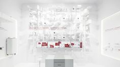 a white room with red and white boxes on the wall