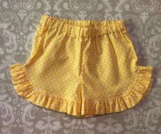 Vintage style stitching with chickens and personalized with child's name on angel sleeve tank. Coordinating ruffle shorts in yellow polka dot Sizes 12m to 10 Please give child's name in notes with your order Cute Summer Bloomers, Playful Ruffled Shorts, Cute Fitted Shorts With Elastic Waistband, Cute Ruffled Cotton Shorts, Playful Short Bloomers For Summer, Playful Summer Short Bloomers, Cute Summer Bloomers With Ruffles, Cute Yellow Summer Shorts, Cute Short Bloomers For Summer