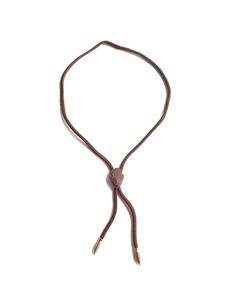 "Vintage bolo necklace made from an adjustable corded necklace with metal tips and the stone center is chiseled into an arrowhead shape. Great vintage western style. The arrowhead is approximately 1.25\" height x 1\" width. The cord necklace end from end is approximately 34\" Please note the stone arrowhead has chips in the stone. Please refer to photos and video. No returns accepted. All items sold As Is. if you have any questions or need additional images please feel free to contact me." Adjustable Brown Lariat Necklaces, Western Style Necklace With Adjustable Cord, Adjustable Brown Lariat Necklace, Brown Adjustable Lariat Necklace, Adjustable Brown Lariat Bolo Tie, Adjustable Western Lariat Necklace, Adjustable Brown Necklaces With Sliding Knot, Adjustable Brown Necklace With Sliding Knot, Adjustable Cord Necklaces With Adjustable Length