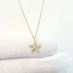 -The Starfish - Sea Star design with zirconia stones women jewelry pendant necklace is made with high-quality 14K real solid gold. - This dainty, cute, charm, delicate and trendy pendant necklace has been artfully designed for timeless yet modern millennial fashion. - This 14K real solid gold pendant comes with a beautiful matching 14K real gold chain. - You receive the pendant in a beautiful and free gift box - Free shipping (Arrive within 4 business days to USA and Canada ( 1 day for productio Gold Starfish Charm Necklace Gift, Yellow Gold Star Necklaces With Starfish Charm, Yellow Gold Starfish Necklace As Gift, Dainty Starfish Necklace For Gift, Dainty Starfish Necklace As Gift, Trendy Pendant Necklace, Millennial Fashion, Snowflake Bracelet, Real Gold Chains